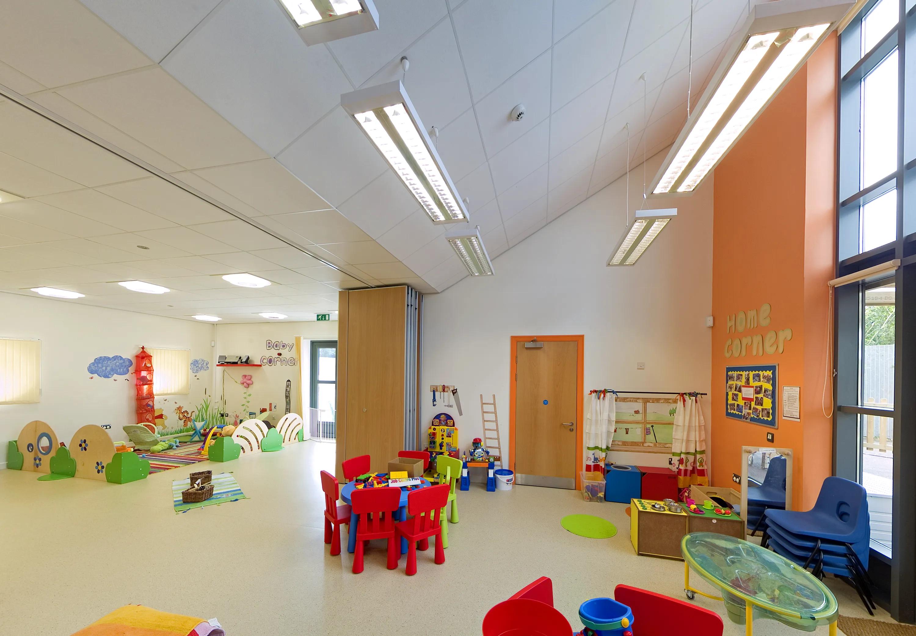 kindergarten classroom with white vaulted ceiling