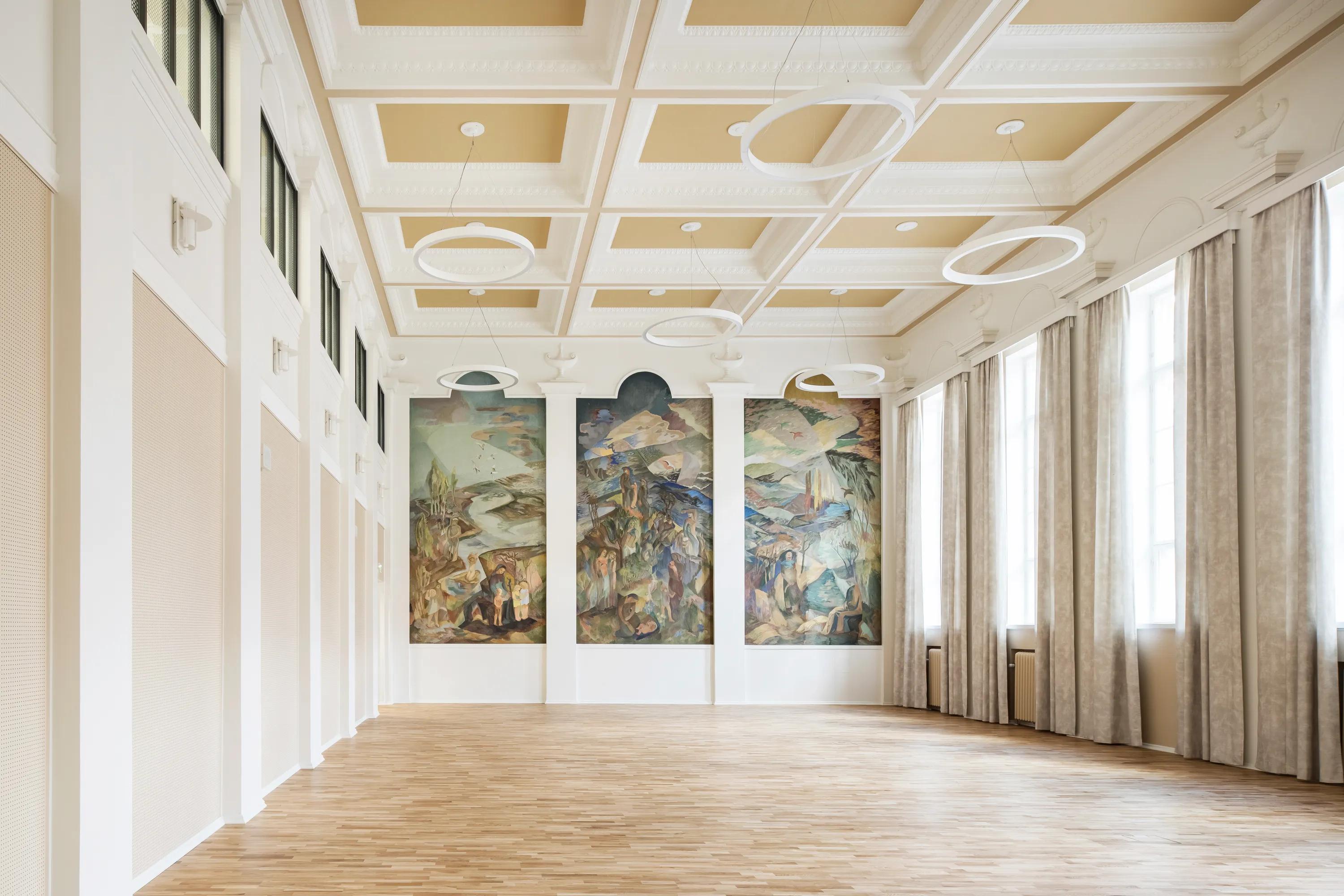 Detail view of a coffered acoustic decorative ceiling with a wall mural
