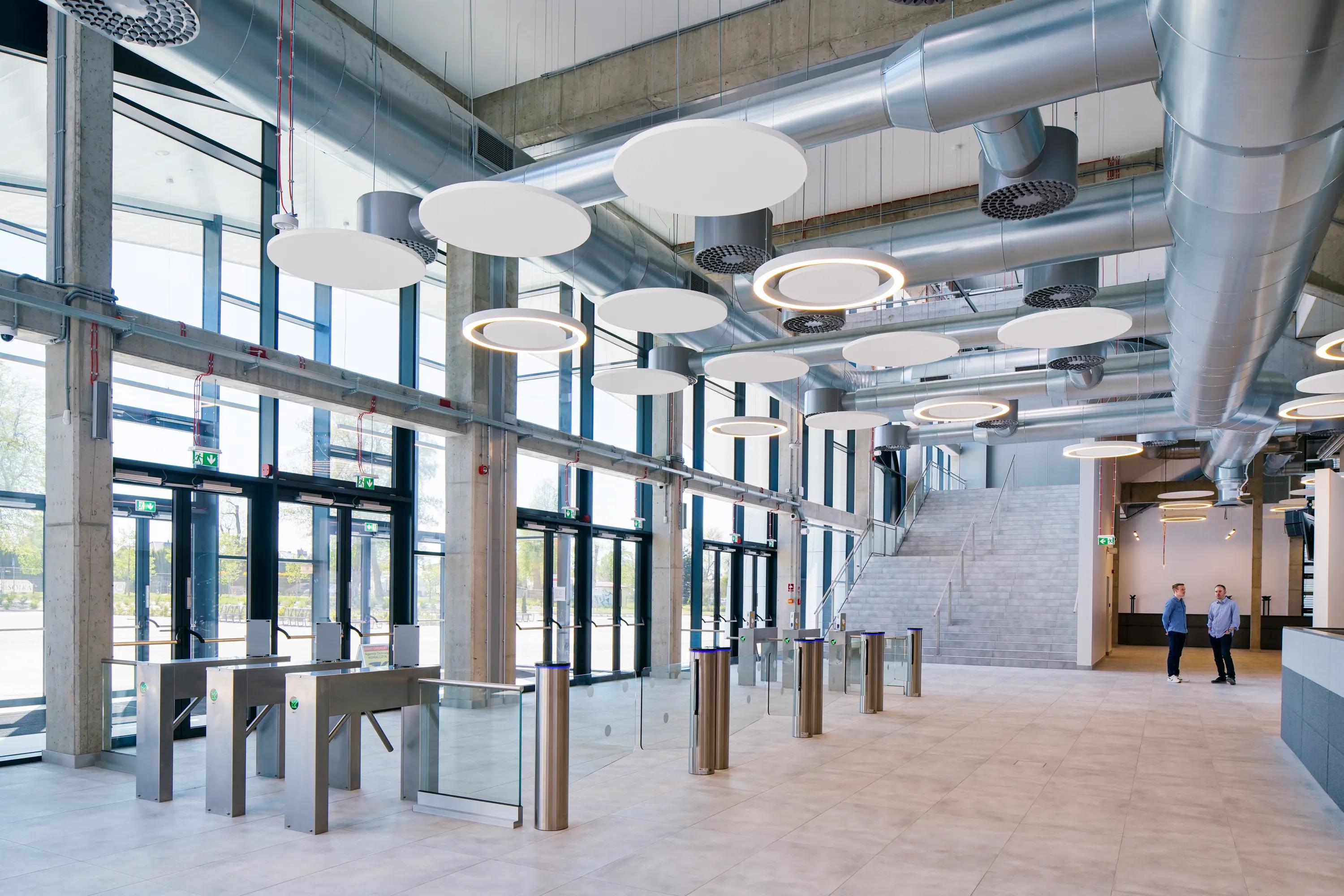 Detail view of Rockfon acoustic floating ceiling panels and suspending ceiling clouds or islands.