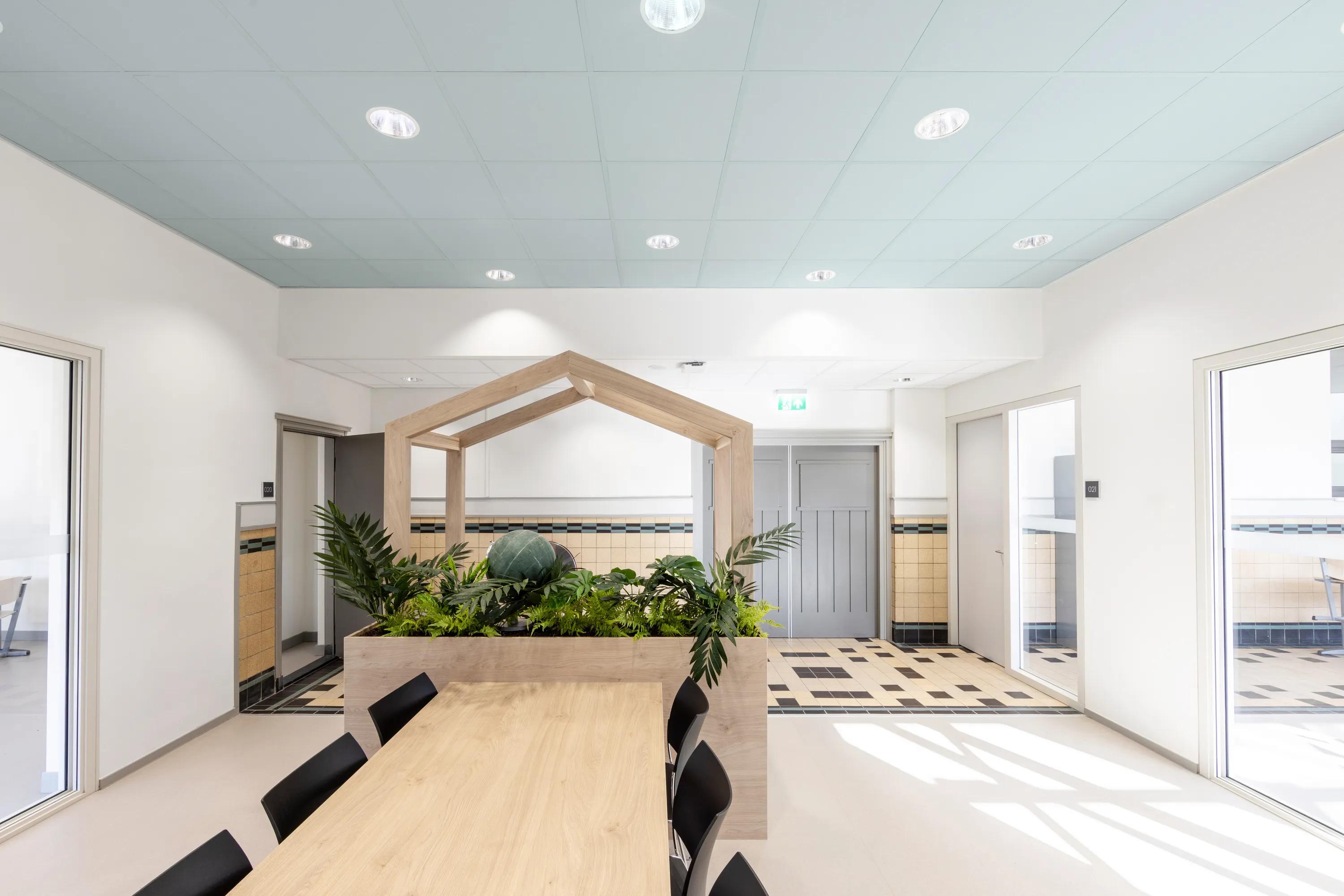 A fire rated suspended ceiling at Norbertus Roosendaal with Rockfon Color-all ceiling tiles in a light blue.
