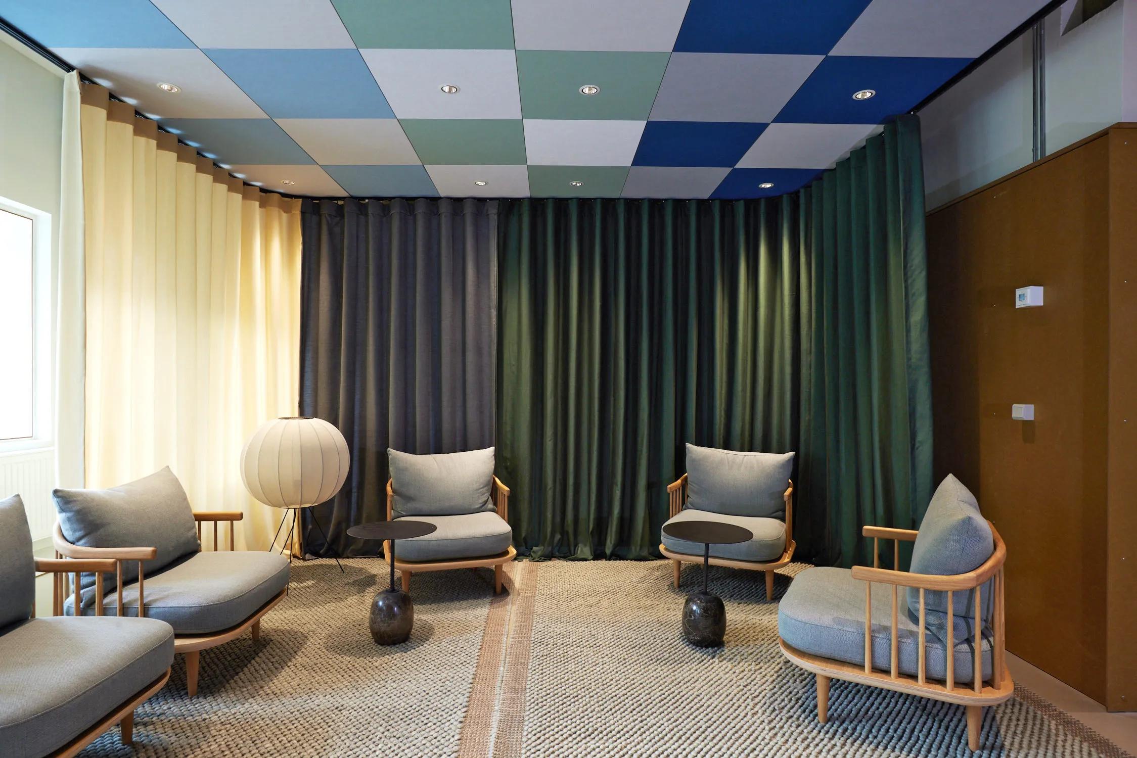 A checkered ceiling design with rich colours and greys.