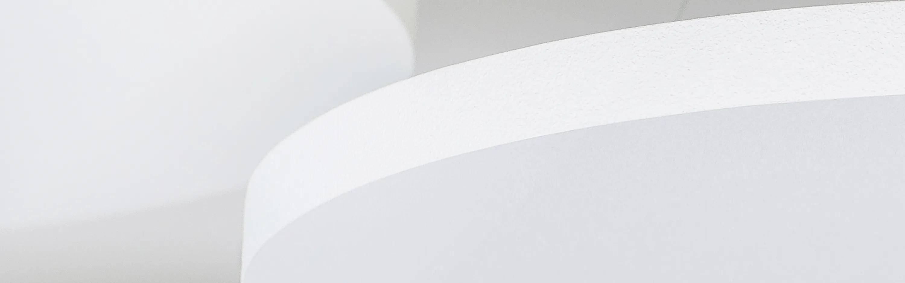 Rockfon white ceiling reflecting daylight to enhance natural lighting.
