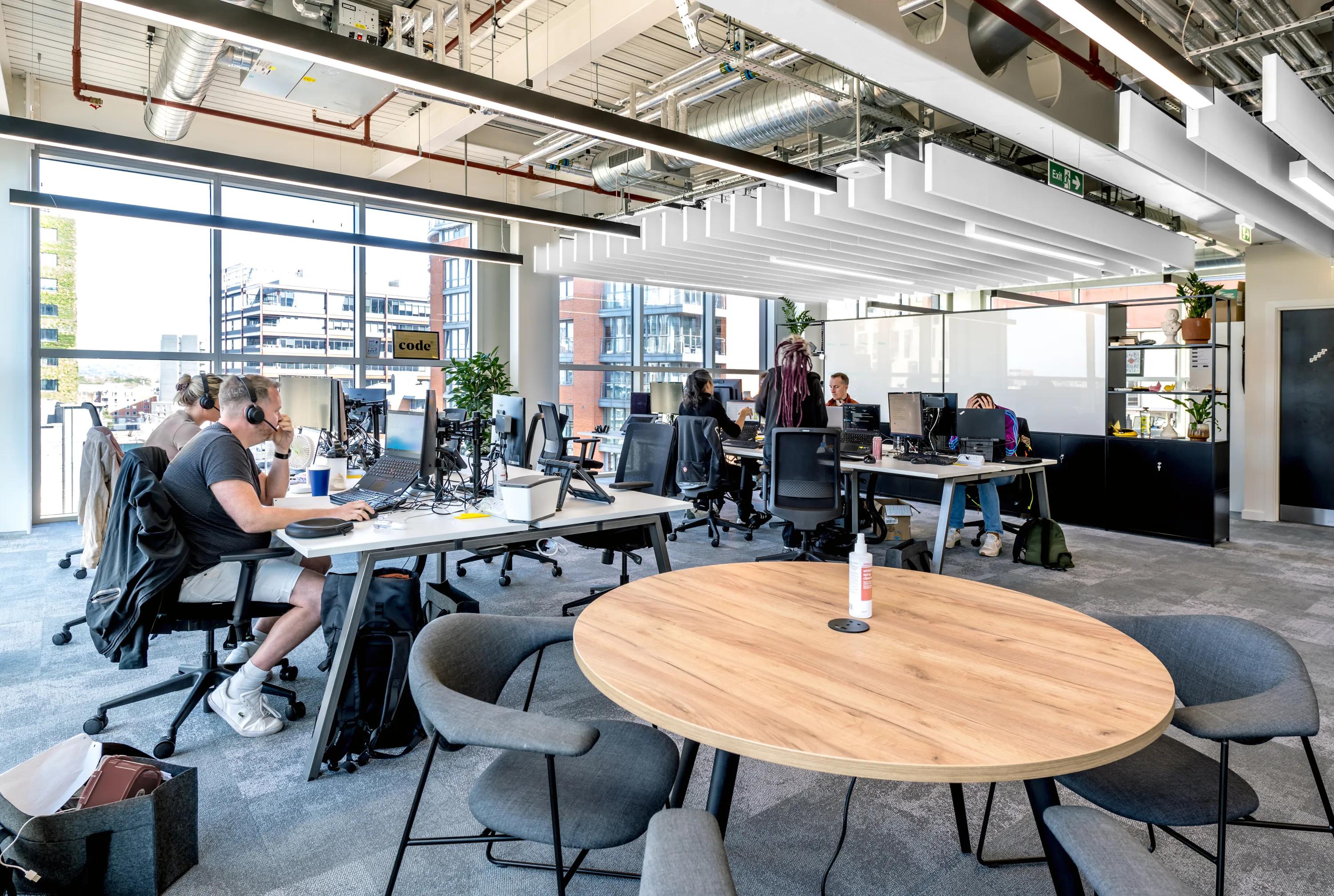 Open Plan Office in WPP in Manchester United Kingdom with a Rockfon Contour baffle ceiling