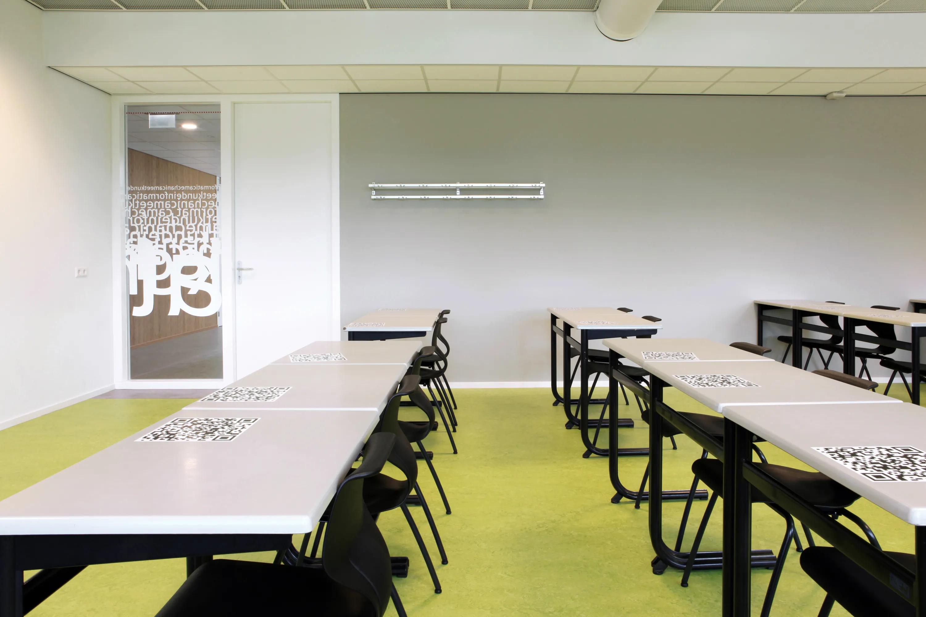classroom with white ceiling and grey wall