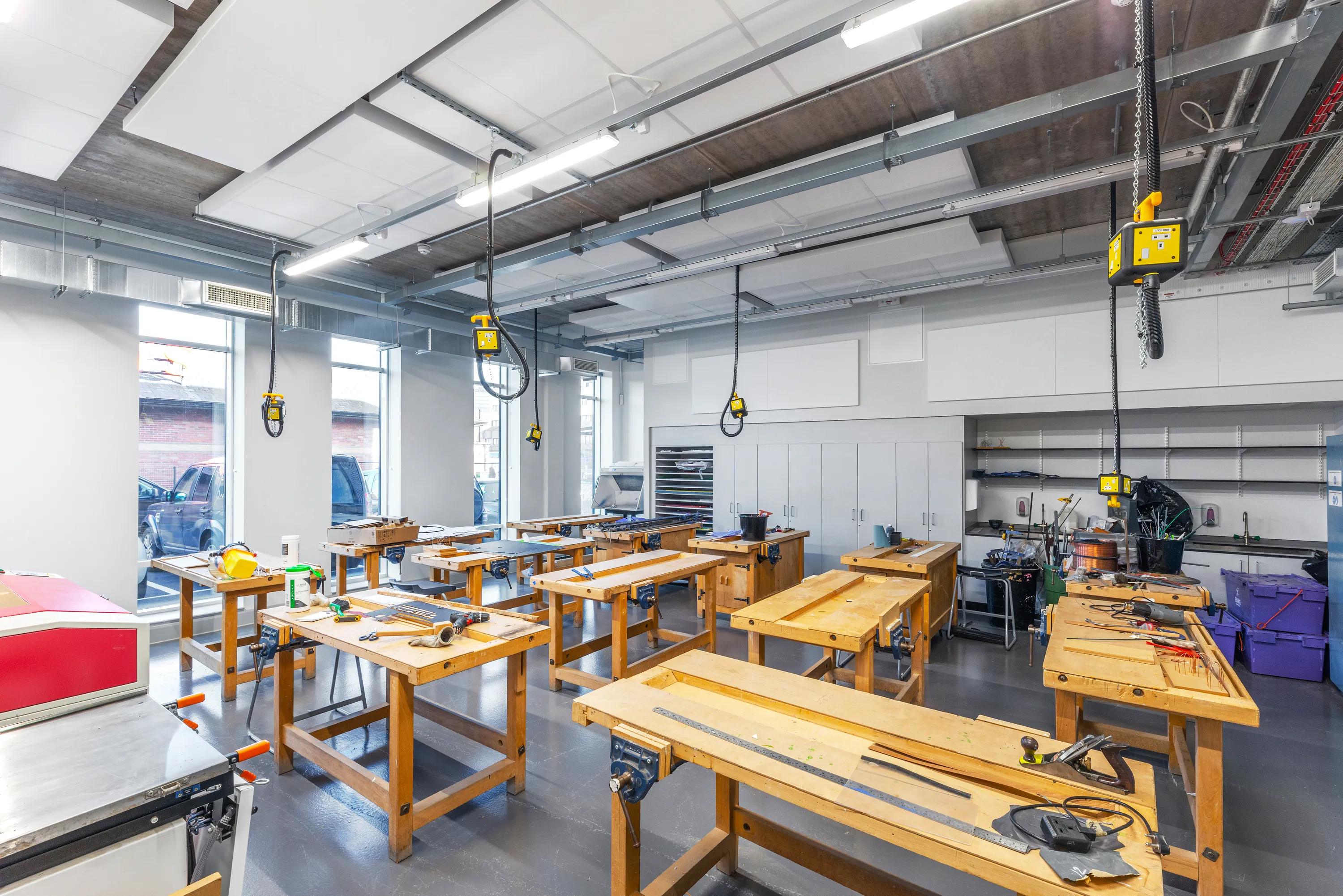 exposed ceiling design with suspended ceiling islands in a classroom