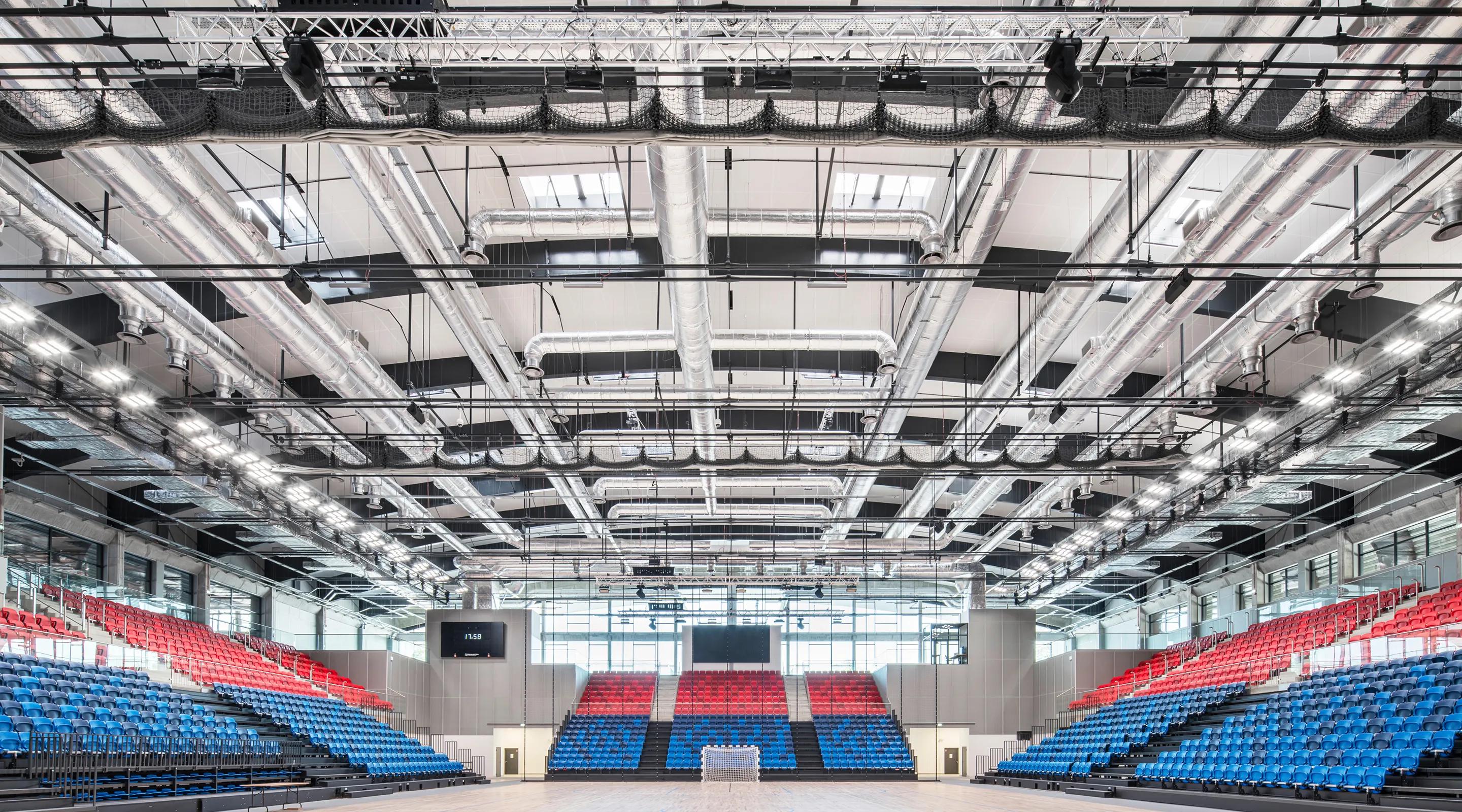 Exterior of MOSiR Entertainment and Sports Hall in Puławy, Poland, designed for high-capacity sports and concert events with modern acoustic solutions