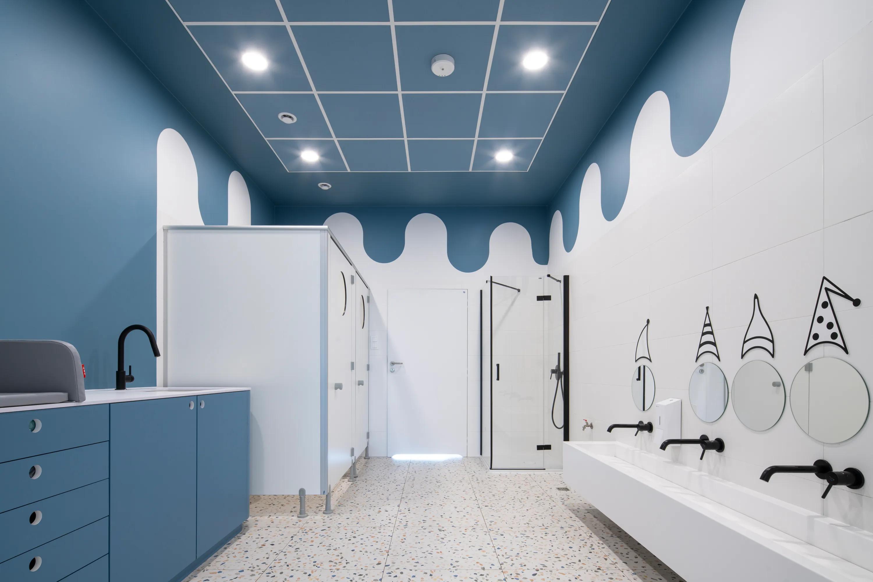 A white and light blue decorative ceiling grid at a children's nursery