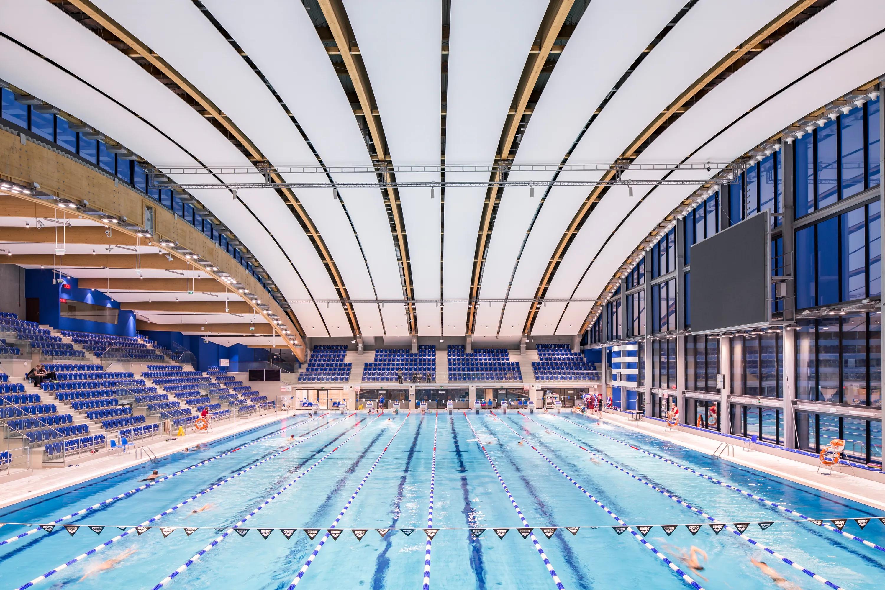 olympic swimming pool ceiling with Rockfon sonar acoustic white tiles