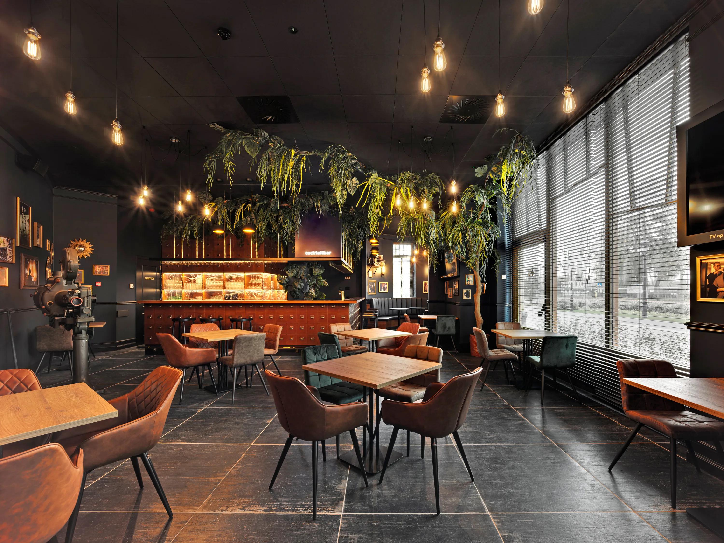 Charcoal ceiling design with Rockfon Color-all in a restaurant